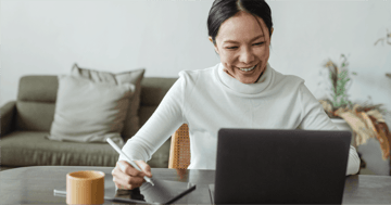 woman happily working in living room